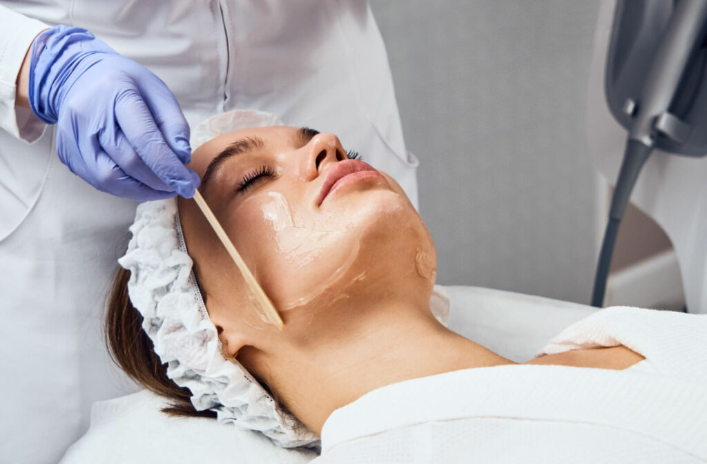 Close-up of a woman getting ultrasound gel application before a laser treatment.
