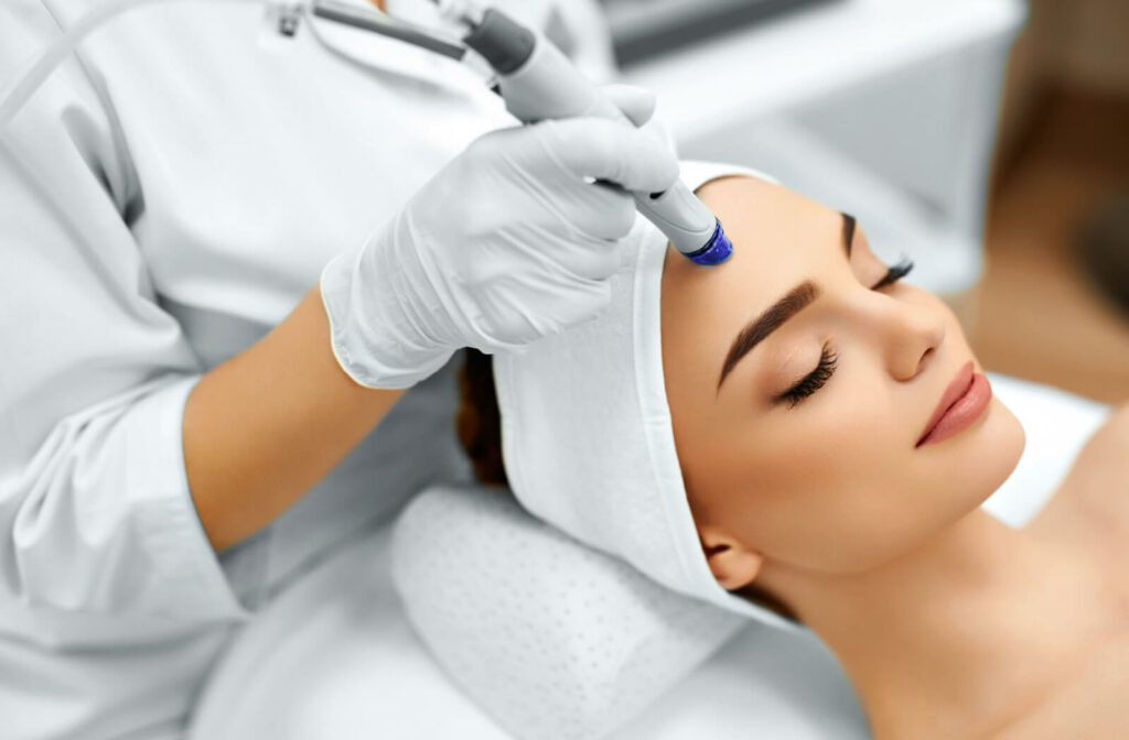 Close-up of a woman receiving a microdermabrasion procedure from a qualified healthcare provider.
