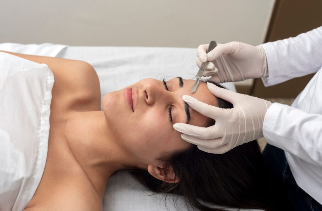 A woman undergoing dermaplaning.